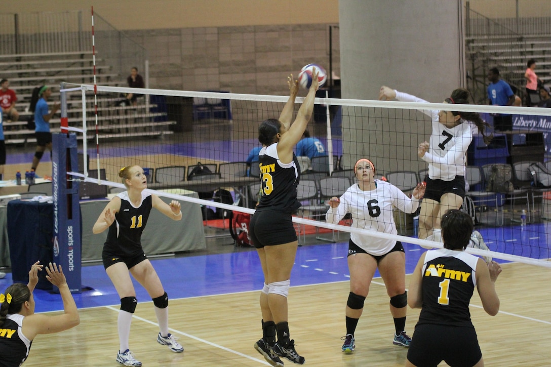PFC Jessica Glover-#13 (Walter Reed, MD) stuffs the spike during Army's championship run during the 2014 USA Volleyball National Championships 26-28 May