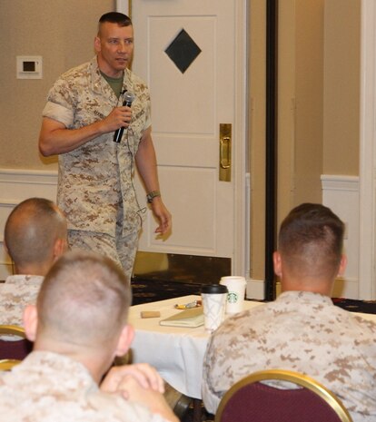 Col. Mike Manning, program manager of Infantry Weapons Systems at Marine Corps Systems Command, Quantico, Virginia, speaks May 13 at the Acquisition Professional Officer Operational Advisory Group. He never thought he would return to acquisition, yet today he is a senior leader at the command. 