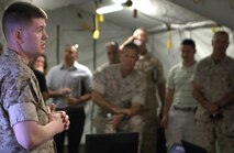 Maj. Troy Peterson briefs visitors May 14 in the Energy Efficient Command Post at Camp Pendleton, California. He is one of the newest Marine Corps ground acquisition professional officers and is assigned to Marine Corps Systems Command, Quantico, Virginia. 