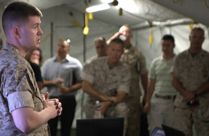 Maj. Troy Peterson briefs visitors May 14 in the Energy Efficient Command Post at Camp Pendleton, California. He is one of the newest Marine Corps ground acquisition professional officers and is assigned to Marine Corps Systems Command, Quantico, Virginia. 