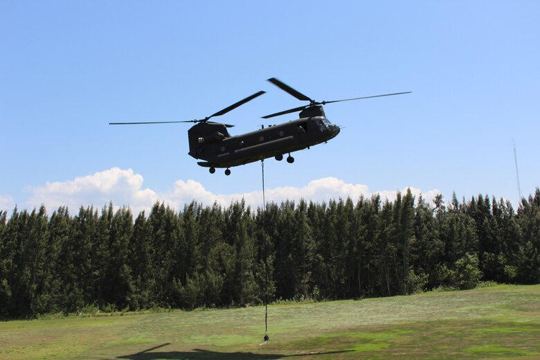 Pilots in a Florida National Guard helicopter practice techniques they would use in the event of a breach at the Herbert Hoover Dike along Lake Okeechobee near Clewiston. Employees at Jacksonville District’s South Florida Operations Office participated in the training as part of activities in advance of hurricane season.