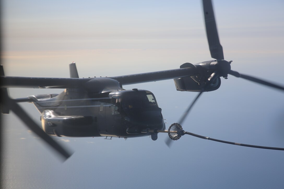 An MV-22B Osprey with Marine Helicopter Squadron 1 receives fuel from a KC-130J Super Hercules from Marine Aerial Refeuler Transport Squadron 252 over the Atlantic May 28, 2014. The Osprey, along with three others from HMX-1, refueled mid-flight during the squadron’s first trans-Atlantic flight.


