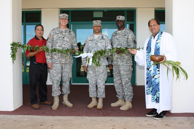 Participating in the traditional maile lei untying  led by Kahu Kordell Kekoa from Kamehameha Schools (right) were (left to right)  Frank Okimoto, Vice President, Nan, Inc. Honolulu Dsitrict Commander Lt. Col. Thomas D. Asbery, Col. James W. Davidson, Commander, Troop Command, TAMC and Command Sgt. Maj. Donald L. George of Troop Command, TAMC. 