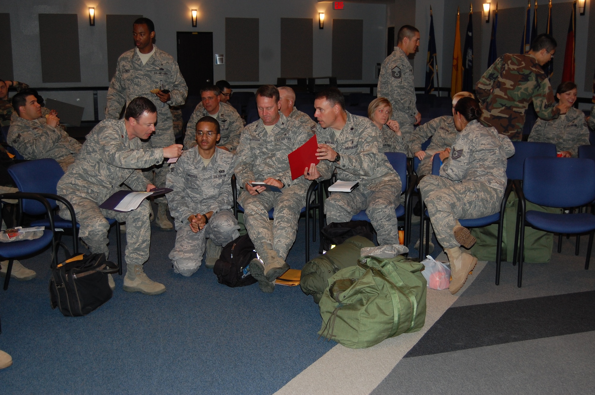 “Dragon Medics” assemble in the auditorium as they prepare for a real-world deployment to Chile after a devastating earthquake.  (U.S. Air Force Photo by Steve Pivnick)