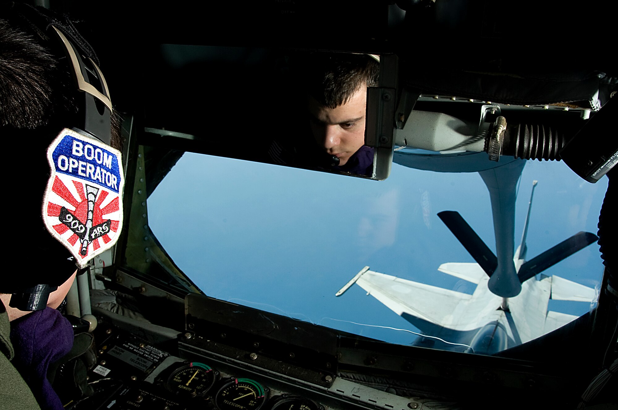 U.S. Air Force Staff Sgt. Eric Cheney, 909th Air Refueling Squadron boom operator, refuels a Republic of Korea air force F-16 Fighting Falcon from a U.S. Air Force KC-135 Stratotanker stationed at Kadena Air Base, Japan, over the ocean May 21, 2014. The training allowed U.S. and ROK service members to bolster procedures and improve interoperability between the two allies. (U.S. Air Force photo by Senior Airman Maeson L. Elleman)