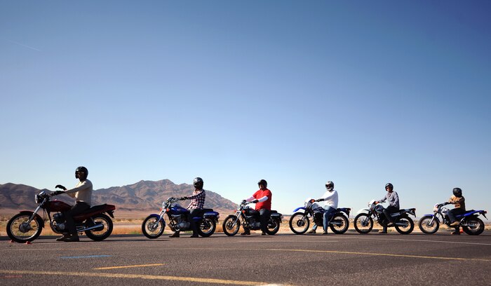 Service members await instructions during the Motorcycle Safety Foundation Basic Riders Course May 29, 2014 at Nellis Air Force Base, Nev. The course provides three days of motorcycle training to teach the basics of safely riding a motorcycle on and off base. (U.S Air Force photo by Airman 1st Class Rachel Loftis)