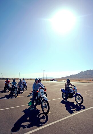 Service members participating in a Motorcycle Safety Foundation Basic Riders Course familiarize themselves with motorcycle dynamics May 29, 2014 at Nellis Air Force Base. The three-day safety course is open to all Department of Defense ID cardholders and no motorcycle experience is required. (U.S Air Force photo by Airman 1st Class Rachel Loftis)