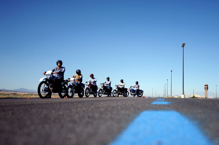 Service members receive instruction during the Motorcycle Safety Foundation Basic Riders Course May 29, 2014 at Nellis Air Force Base, Nev. The three-day course provides extensive motorcycle training and is mandatory for anyone wanting to ride a motorcycle on or off base.   (U.S Air Force photo by Airman 1st Class Rachel Loftis)