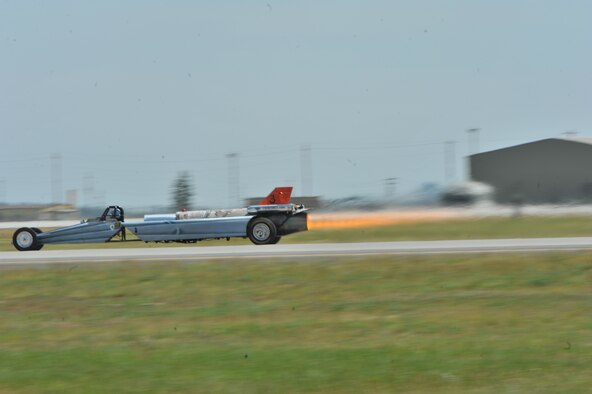 Bill Braack drives the Smoke-N-Thunder jet car during a performance during SkyFest 2014 at Fairchild Air Force Base, Wash., June 1, 2014. The jet car is equipped with a J34-48 engine originally used in the North American Buckeye T-2A aircraft. The jet car has 10,000 horsepower and 6,000 pounds of thrust with an afterburner. The jet car races at speeds approaching nearly 400 mph. During the performance, Braack pulls 4.5 Gs when accelerating and experiences 11 Gs of negative force as the car comes to a stop. (U.S. Air Force photo by Staff Sgt. Veronica Montes/Released)