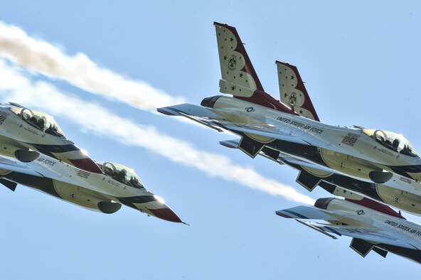 Crowds watch the acts during SkyFest 2014 at Fairchild Air Force Base, Wash., June 1, 2014. SkyFest 2014 hosted more than 15 types of aircraft and static displays and more than 10 flying performers including the U.S. Air Force Thunderbirds and the U.S. Army Parachute Team, “Golden Knights.” (U.S. Air Force photo by Staff Sgt. Alexandre Montes/Released)