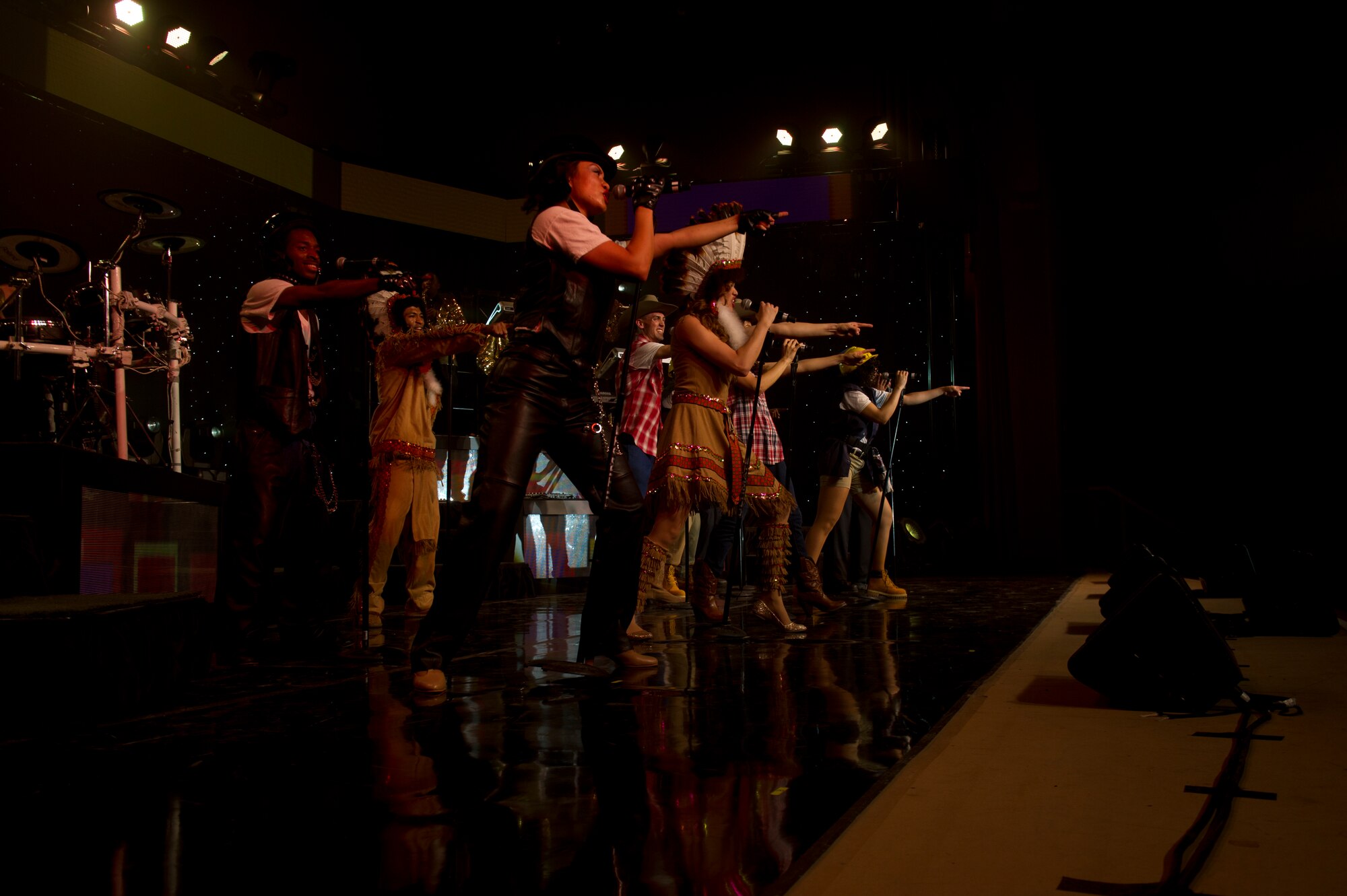 Members of Tops in Blue perform a song and dance for the crowd during their live concert at Tays Center, Alamogordo, N.M., May 31. Tops in Blue is comprised of vocalists, musicians, dancers and technicians serving in the U.S. Air Force. The group’s primary mission is to perform for military personnel and their families throughout the world. (U.S. Air Force photo by Airman 1st Class Aaron Montoya / Released)