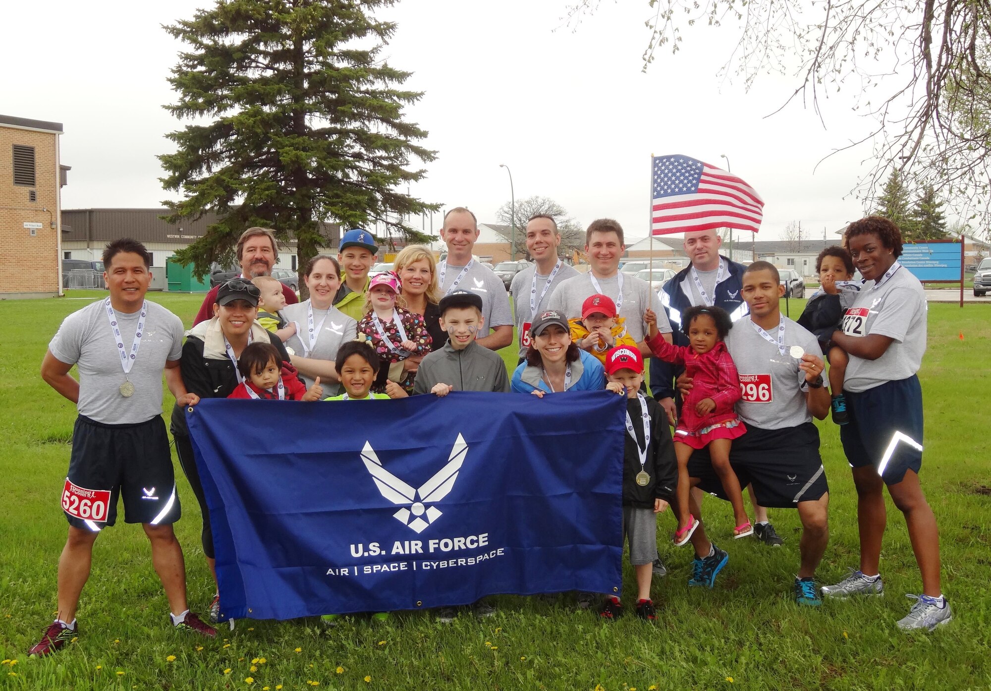 Members of Detatchment 1, First Air Force, and their families participated in the Royal Canadian Air Force half marathon in Winnipeg, Manitoba, Canada, May 25, 2014. Detachment 1 provides the Canadian NORAD Region with USAF liaison and expertise at the Combined Aerospace Operations Center and Air Division Headquarters. (Courtesy photo by Jennifer Servant)