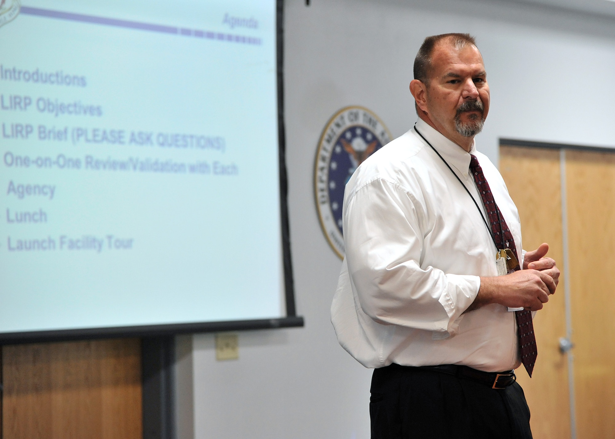 Stanley Moody, 341st Security Forces Group plans and programs manager, gives the itinerary of events for the Local Incident Response Plan conference at Malmstrom Air Force Base, Montana on May 29. The conference was an opportunity for military and civilian law enforcement agencies from around the state to discuss the response contingency if a nuclear weapon was ever threatened by an adversary. (U.S. Air Force photo / John Turner)