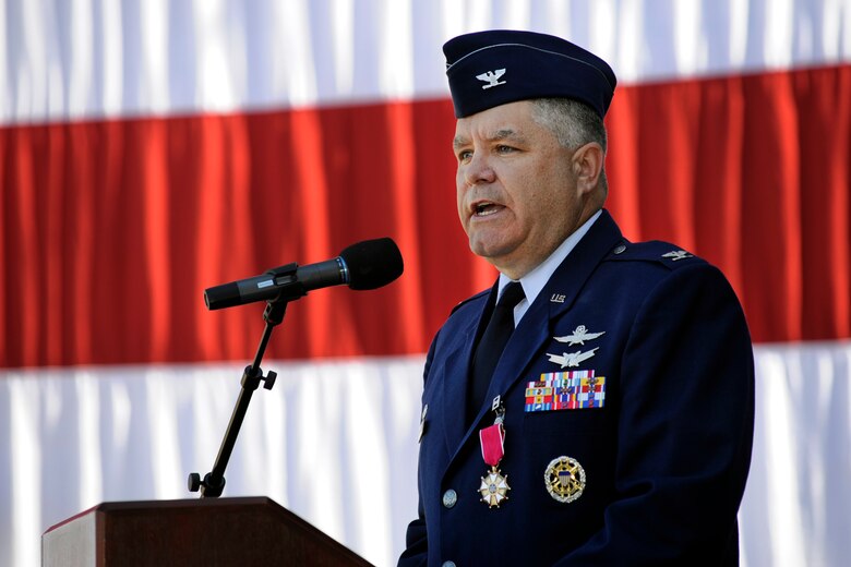 Col. Jonathan Sutherland addresses the 50th Network Operations Group for one last time as commander during the group’s change of command ceremony May 28, 2014, at the 50th Space Wing headquarters building. (U.S. Air Force photo/Dennis Rogers)
