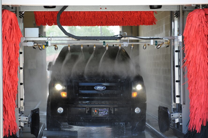 Staff Sgt. Pamela Bradford, 2nd Maintenance Group command staff, drives her vehicle through the Auto Hobby Shop's Car Wash on Barksdale Air Force Base, La., June 2, 2014. The Auto Hobby Shop's Car Wash offers four different wash options which include a combo wash, soft wash, touch free and basic wash.  (U.S. Air Force photo/Senior Airman Benjamin Gonsier)