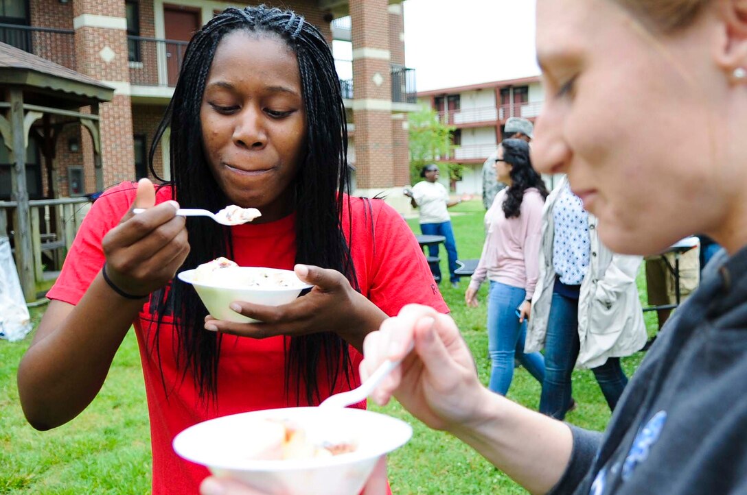 U.S. Air Force Airman 1st Class Amber Cameron, 633rd Medical Group radiology technician, enjoys some ice cream during an ice cream social at Langley Air Force Base, Va., May 30, 2014. Senior enlisted Airmen provided free ice cream for Airmen living in the dormitories. (U.S. Air Force photo by Senior Airman Austin Harvill/Released)