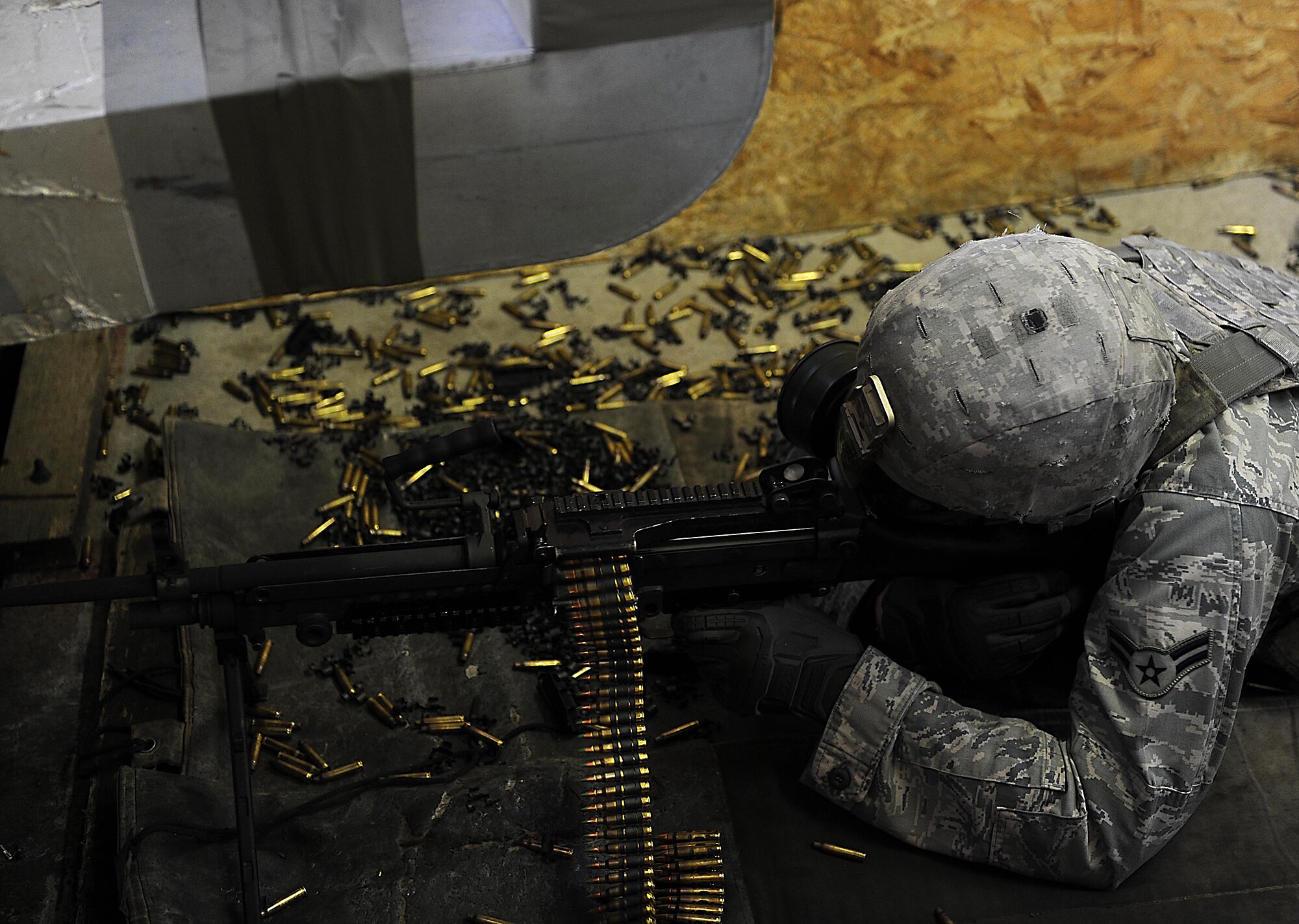 MINOT AIR FORCE BASE, N.D. -- Airmen go through the 5th Security Forces Squadron Combat Arms Training & Maintenance course at Minot Air Force Base, N.D., May 28,2014, to prep for deployments and needed qualifications for a variety of weapons systems. CATM instructors teach two classes a day plus a remedial class, pushing through 125 students a week. Safety is vital when firing a weapon, and when the CATM members are out on the line with students, they take every precaution to ensure everyone leaves unharmed. (U.S. Air Force photo/Senior Airman Kristoffer Kaubisch)