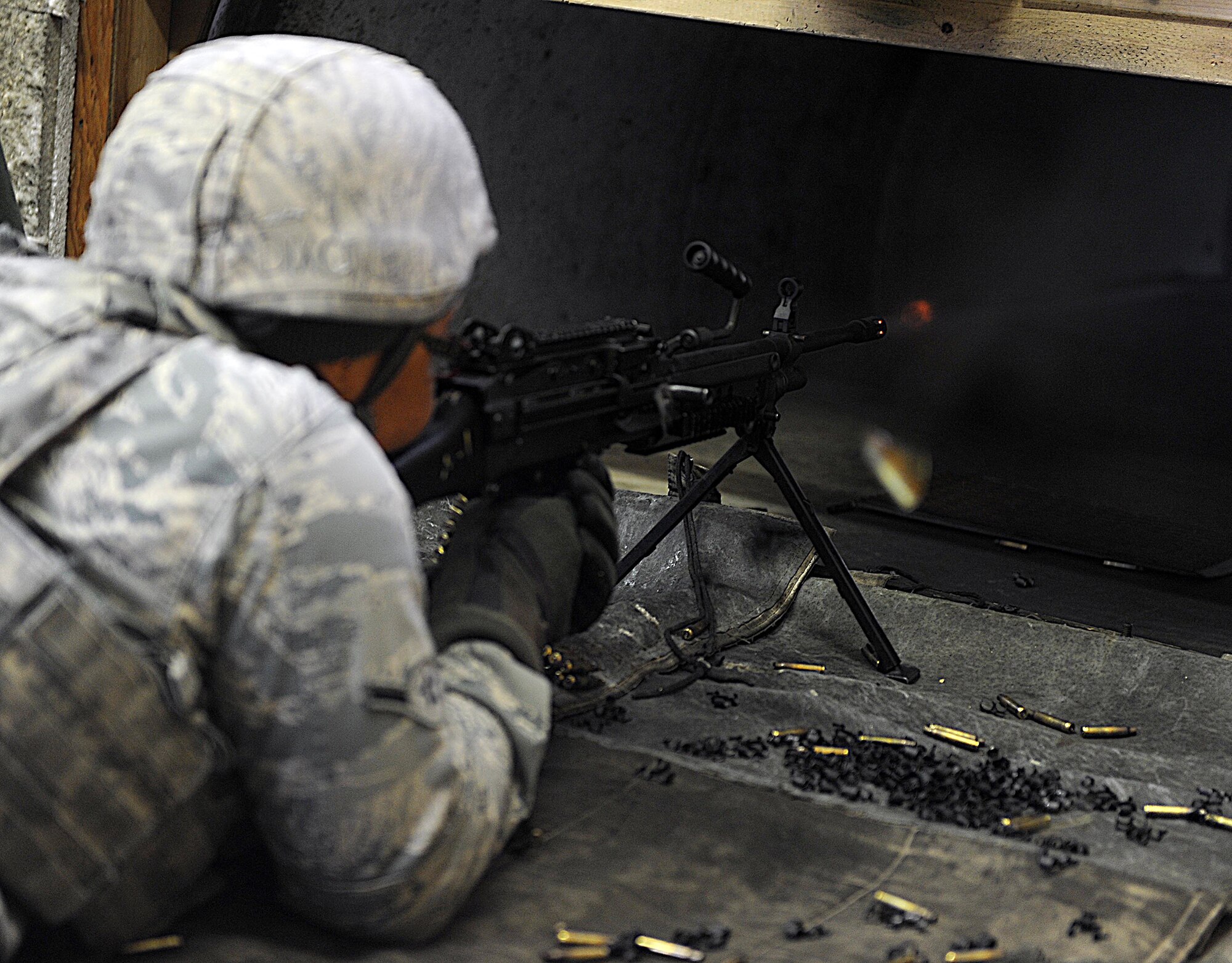 MINOT AIR FORCE BASE, N.D. -- Airmen go through the 5th Security Forces Squadron Combat Arms Training & Maintenance course at Minot Air Force Base, N.D., May 28,2014, to prep for deployments and needed qualifications for a variety of weapons systems. CATM instructors teach two classes a day plus a remedial class, pushing through 125 students a week. Safety is vital when firing a weapon, and when the CATM members are out on the line with students, they take every precaution to ensure everyone leaves unharmed. (U.S. Air Force photo/Senior Airman Kristoffer Kaubisch)