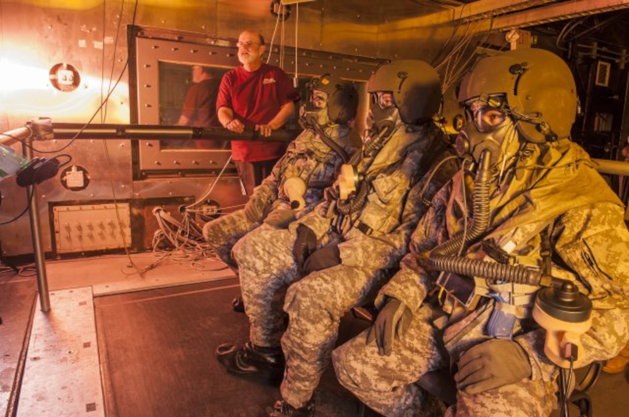 Bruce Cadarette of the U.S. Army Research Institute of Environmental Medicine at Natick Soldier Systems Center in Natick,Mass., monitors volunteers in MOPP 4 gear during testing of a body-worn microclimate cooling system for helicopter aircrew members in Doriot Climatic Chambers. (U.S. Army photo by David Kamm/Released)