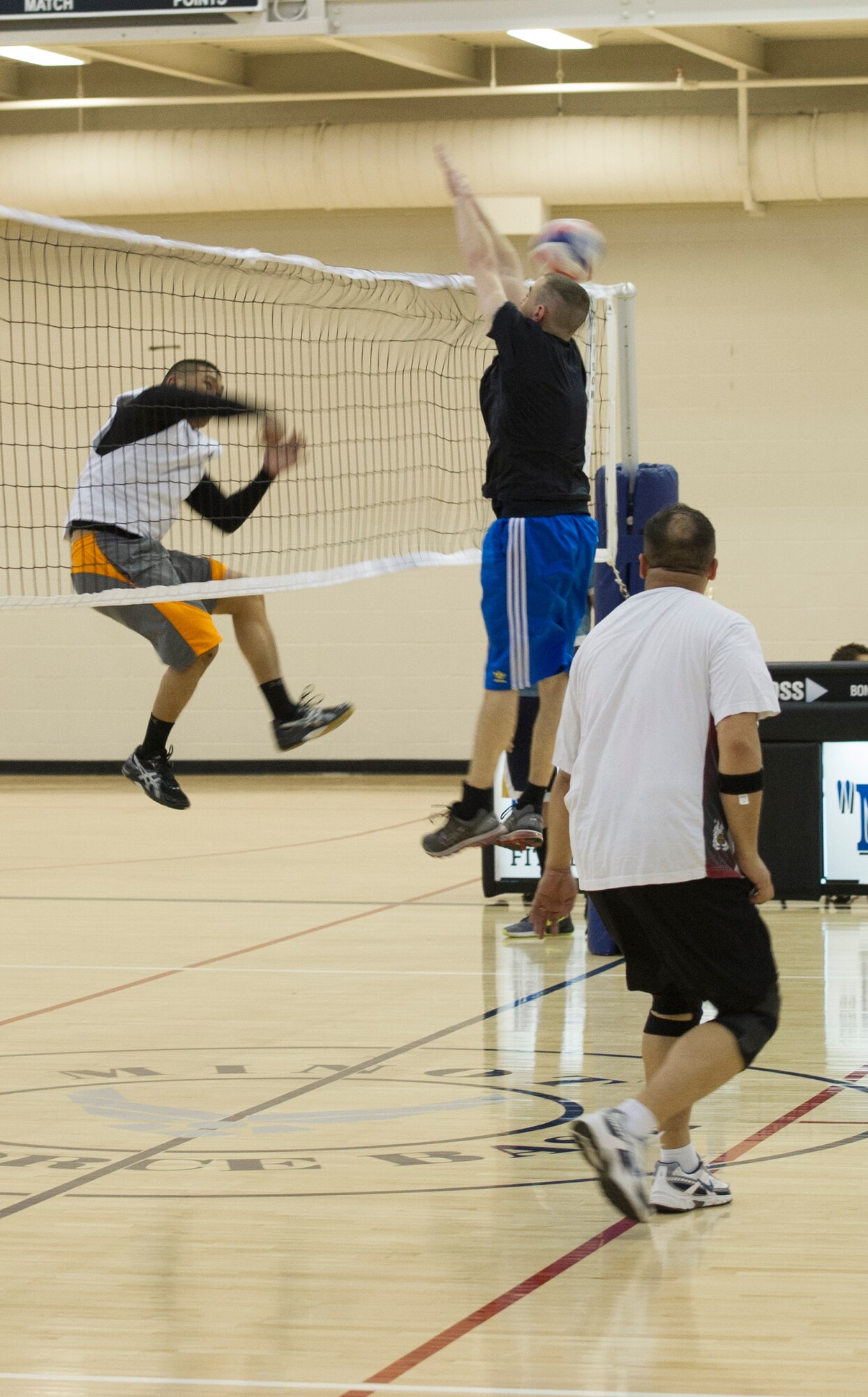The 91st Missile Maintenance Squadron played the 5th Logistics Readiness Squadron during the intramural volleyball championship game May 28 at Macadoo Fitness Center located at Minot Air Force Base, N.D. Following the two game championship series, the 91st Missile Maintenance Squadron brought home the championship trophy after winning two games in a row. (U.S. Air Force photo/Senior Airman Andrew Crawford)