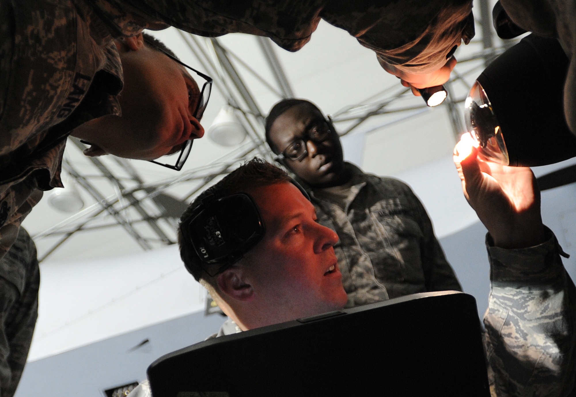 Airmen from the 432nd Aircraft Maintenance Squadron Tiger Aircraft Maintenance Unit weapons load crew inspect an AGM- 114 Hellfire missile loaded on an MQ-9 Reaper prior to launch at Creech Air Force Base, Nev., May 12, 2014. The 432nd Maintenance Group has continuously exceeded the RPA standard mission capable rate of 86 percent set by Air Combat Command through sound maintenance practices. Mission capable means the aircraft has no supply or maintenance issues preventing it from successfully completing a mission. (U.S. Air Force photo by Senior Master Sgt. C.R./Released)