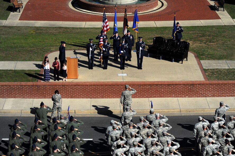 The child of Col. Jeannie Leavitt, outgoing 4th Fighter Wing commander, sings the national anthem during the 4th FW change of command ceremony, June 2, 2014, at Seymour Johnson Air Force Base, North Carolina. Leavitt, the first female to command an active duty Air Force fighter wing, relinquished command to Col. Mark Slocum. (U.S. Air Force photo/Airman 1st Class Aaron J. Jenne)