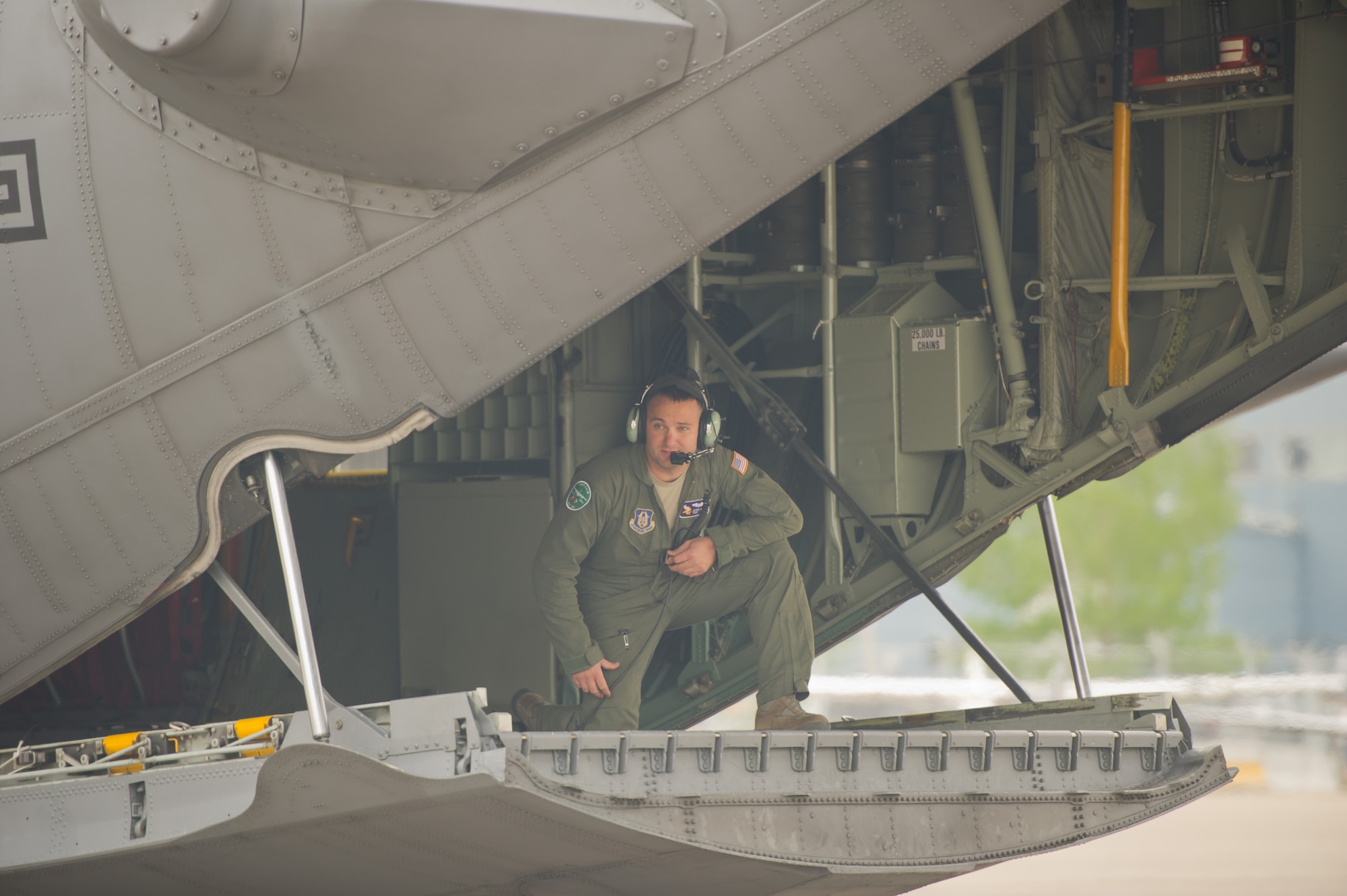 U.S. Air Force Tech. Sgt. Jesse Kupka, 934th Airlift Wing, Minneapolis Air Reserve Station, Minn., guides a C-130H Hercules aircraft while it performs flight line maneuvers during Maple Flag 47 in Edmonton/Cold Lake, Alberta, Canada, May 26, 2014. Maple Flag is an international exercise designed to enhance the interoperability of C-130 aircrews, maintainers and support specialists in a simulated combat environment. (U.S. Air Force photo by Tech. Sgt. Matthew Smith/Released)
