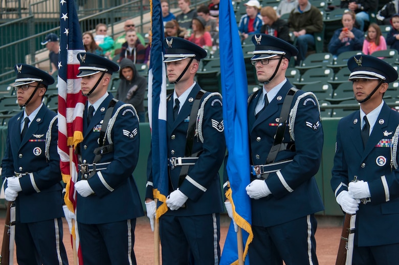 The High Frontier Honor Guard prepares to present the colors before the Colorado Springs Sky Sox baseball game May 22, 2014, at Colorado Springs, Colo. The Sky Sox held a Schriever night and offered free tickets to members of the base. (U.S. Air Force photo/Senior Airman Naomi Griego)  
