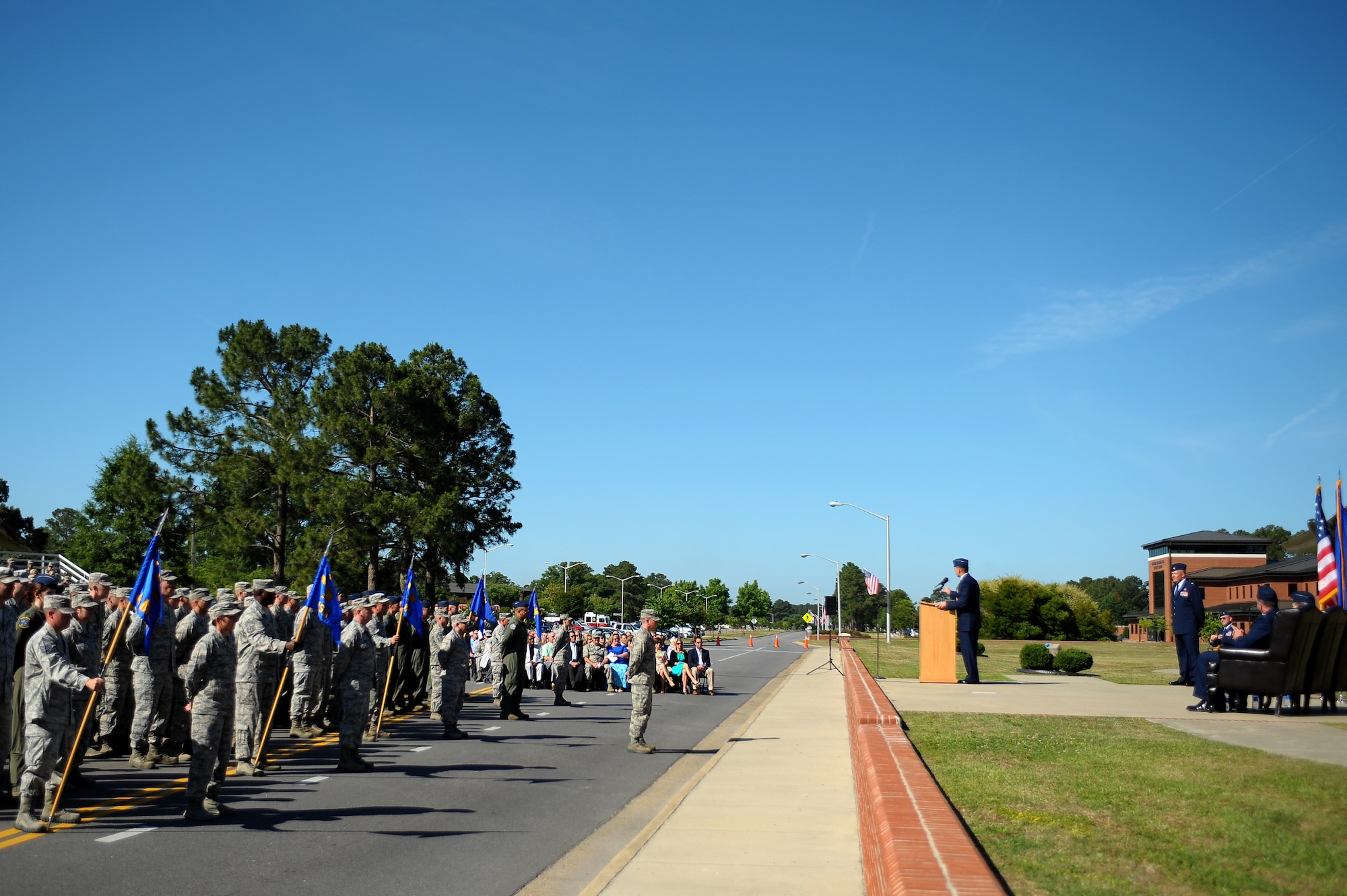 Airmen of the 4th Fighter Wing stand in formation during a change of command ceremony, June 2, 2014, at Seymour Johnson Air Force Base, North Carolina. Col. Jeannie Leavitt, the first female to command an active duty Air Force fighter wing, relinquished command to Col. Mark Slocum. (U.S. Air Force photo/Tech. Sgt. Brittany E. Jones)