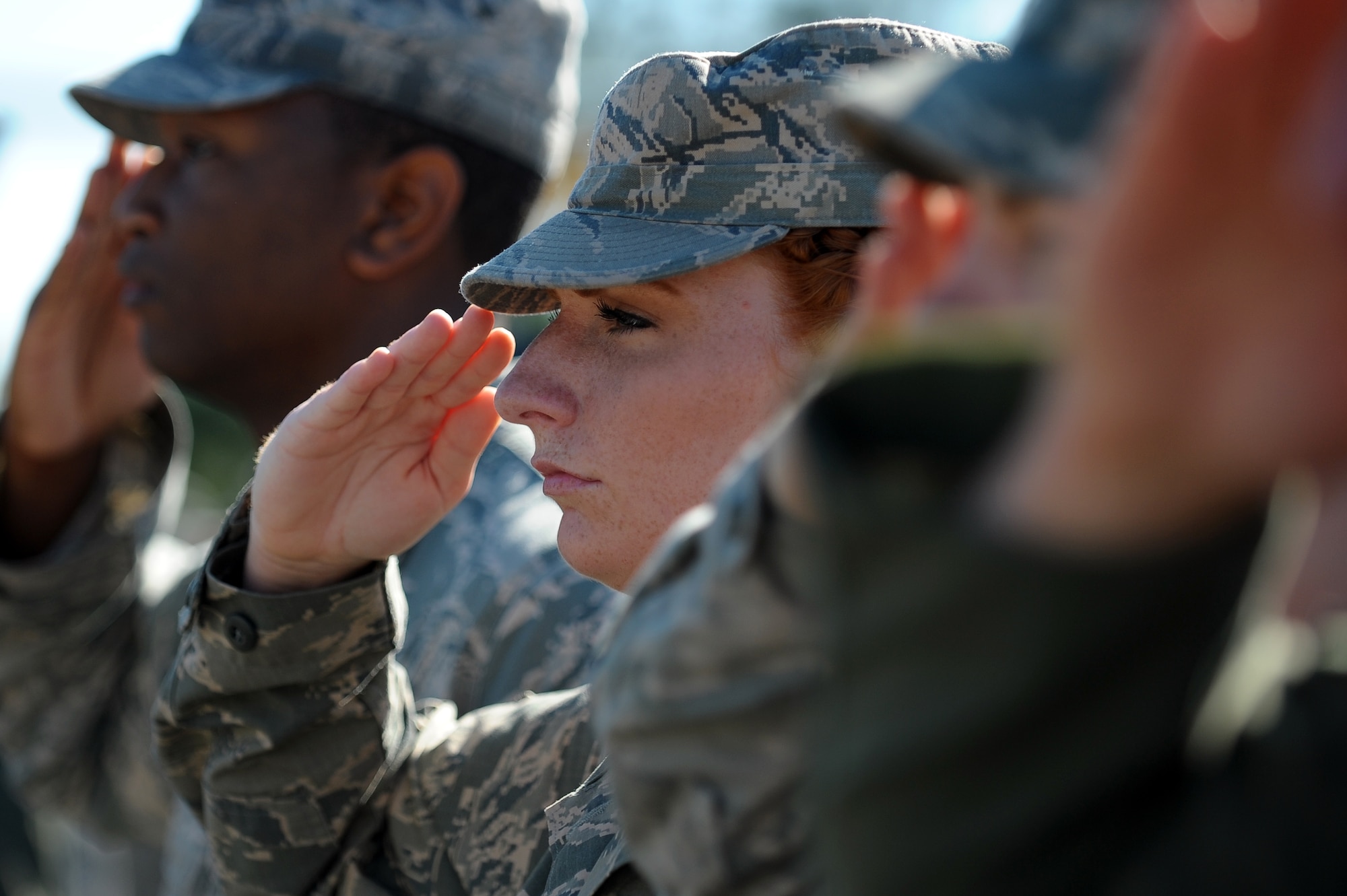 Senior Airman Erica Craft, 4th Fighter Wing judge advocate paralegal, salutes during the 4th FW change of command ceremony, June 2, 2014, at Seymour Johnson Air Force Base, North Carolina. Col. Mark Slocum assumed command from Col. Jeannie Leavitt during the ceremony. (U.S. Air Force photo/Tech. Sgt. Brittany E. Jones)