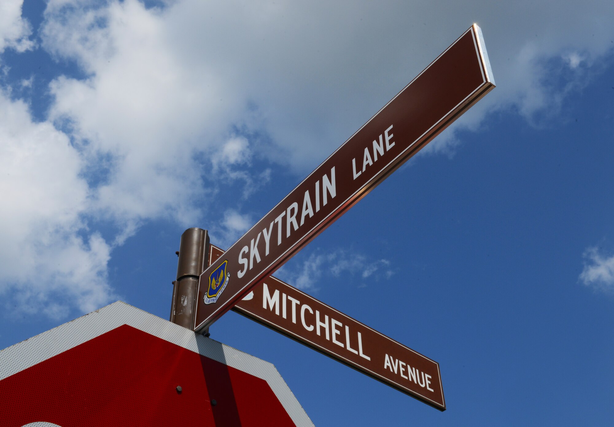 The name of the new street on Ramstein Air Base was unveiled during a street-naming ceremony June 2, 2014. The street was named Skytrain Lane after the namesake of the 37th Airlift Squadron’s heritage transport aircraft, the C-47, which was used during the D-Day invasion of Normandy, France. (U.S. Air Force photo/Staff Sgt. Travis Edwards)