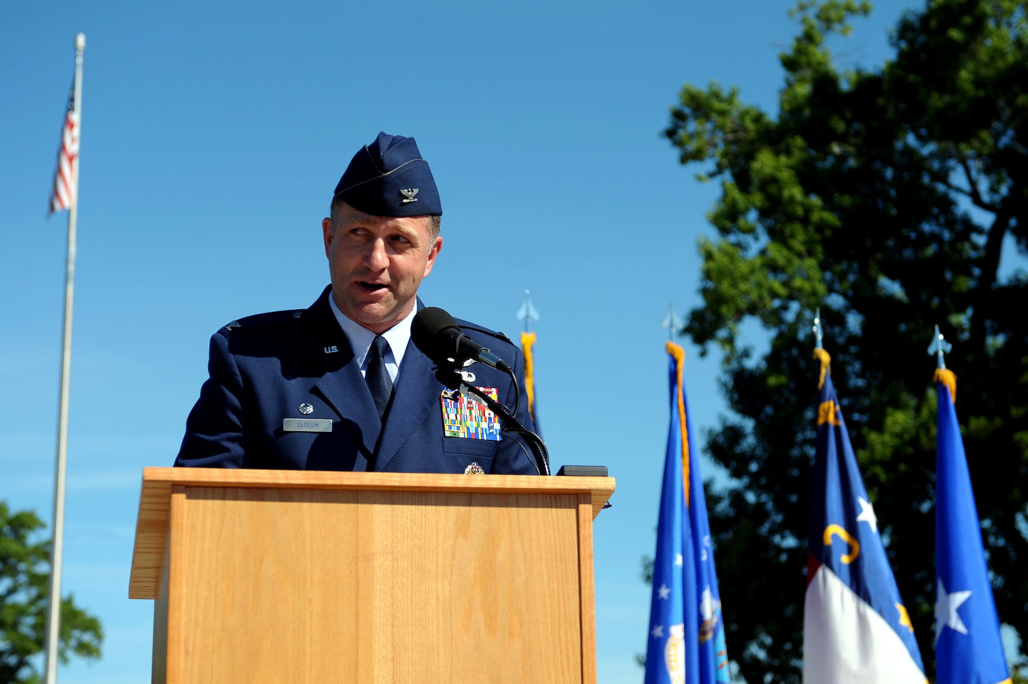 Col. Mark Slocum, new 4th Fighter Wing commander, speaks during the wing change of command ceremony, June 2, 2014, at Seymour Johnson Air Force Base, North Carolina. Slocum was assigned to Seymour Johnson twice before and logged more than 2600 flight hours, including 925 combat hours and 252 combat sorties. (U.S. Air Force photo/Tech. Sgt. Brittany E. Jones)
