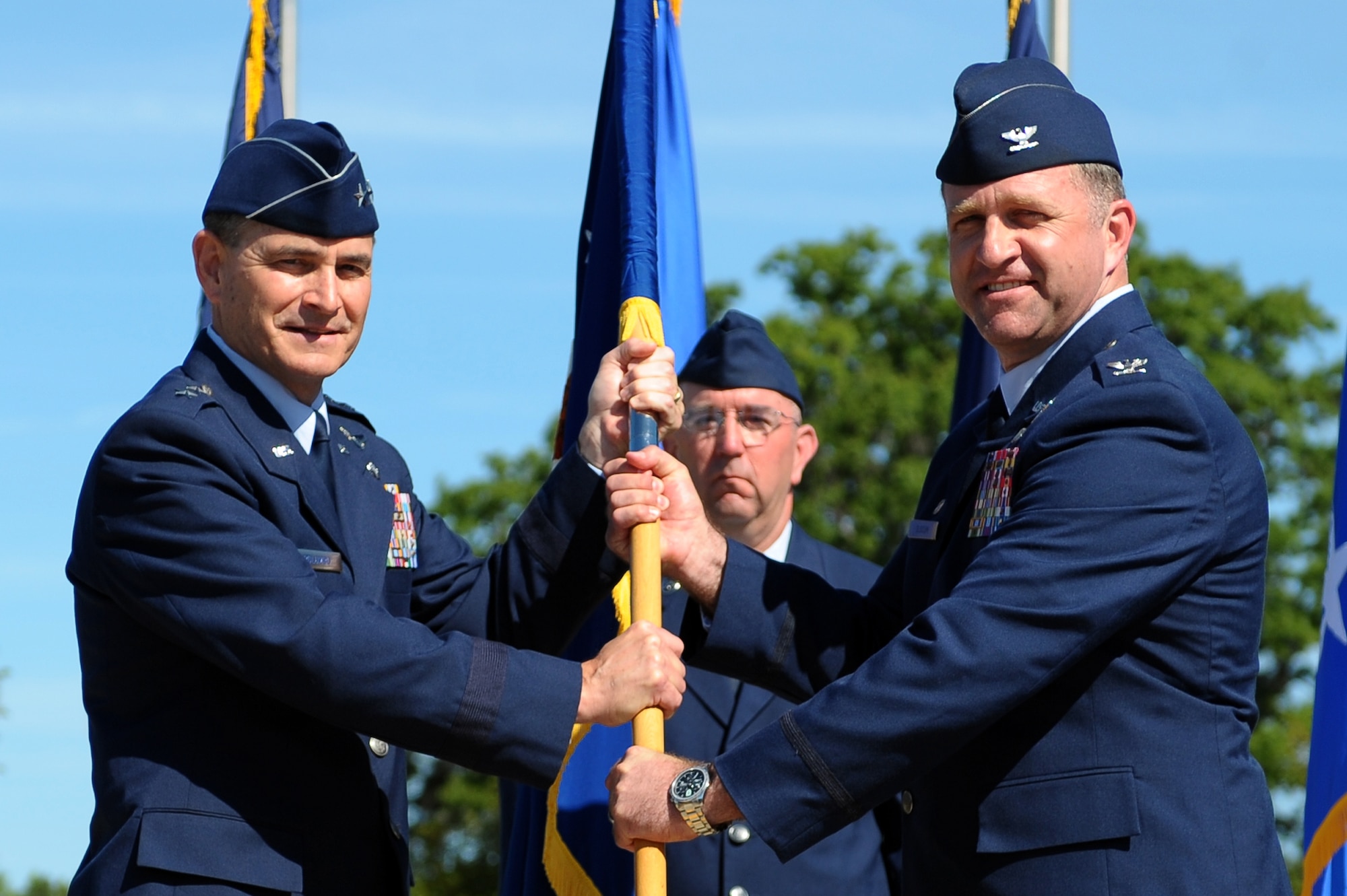 Maj. Gen. H.D. Polumbo, Jr., Ninth Air Force commander, passes the guidon to Col. Mark Slocum during the 4th Fighter Wing change of command ceremony, June 2, 2014, at Seymour Johnson Air Force Base, North Carolina. Slocum assumed command of the 4th FW from Col. Jeannie Leavitt. Slocum was previously the 48th Operations Group commander at Royal Air Base Lakenheath, England. (U.S.
Air Force photo/Tech. Sgt. Brittany E. Jones)
