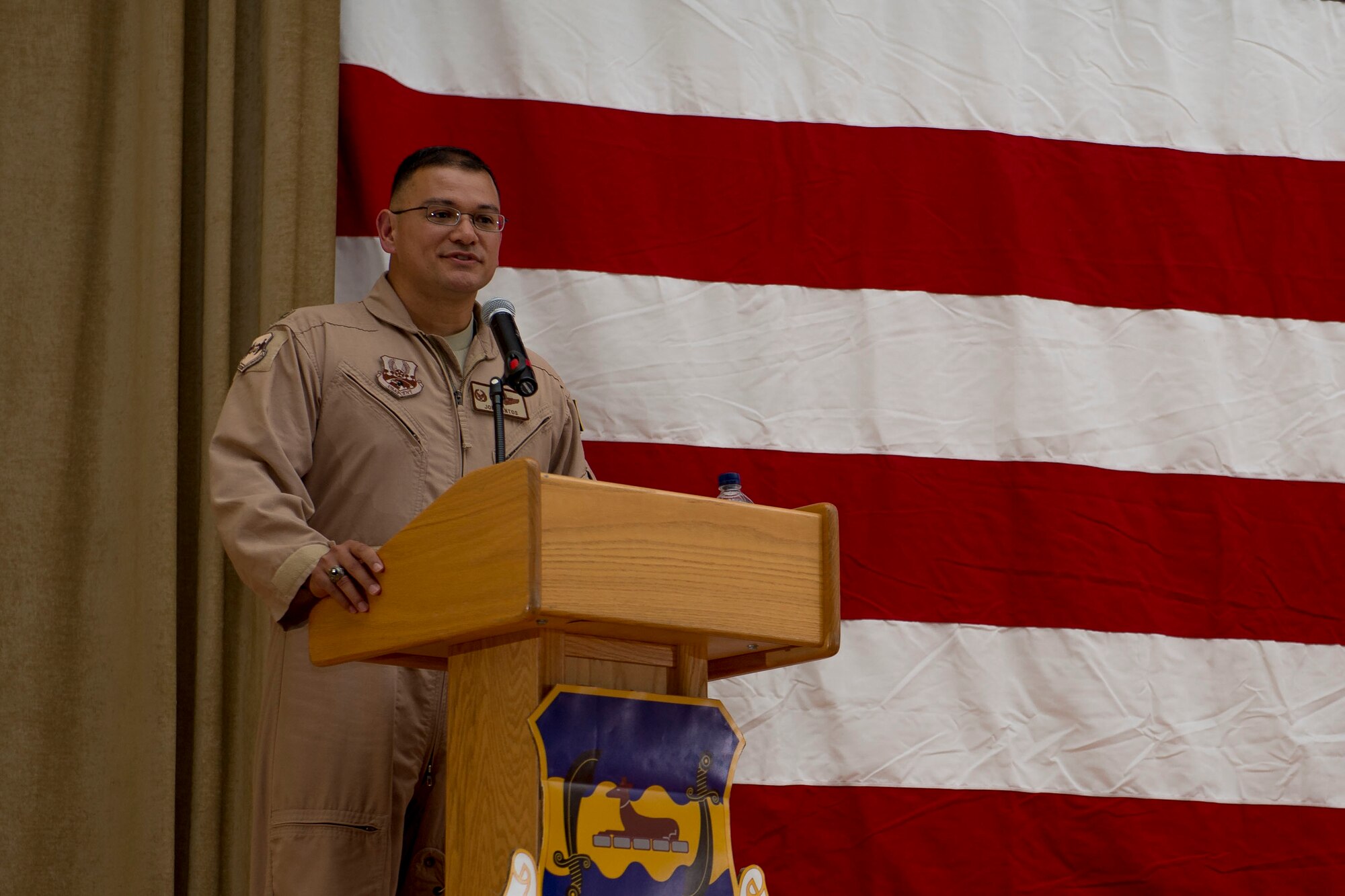 U.S. Air Force Col. Joe Santos speaks to Airmen after assuming command of the 386th Expeditionary Operations Group June 1, 2014 at an undisclosed location in Southwest Asia. Santos comes from the U.S. Transportation Command, Scott Air Force Base, Illinois where he was the deputy chief, west division and deployment and distribution operations center chief.  (U.S. Air Force photo by Staff Sgt. Jeremy Bowcock)