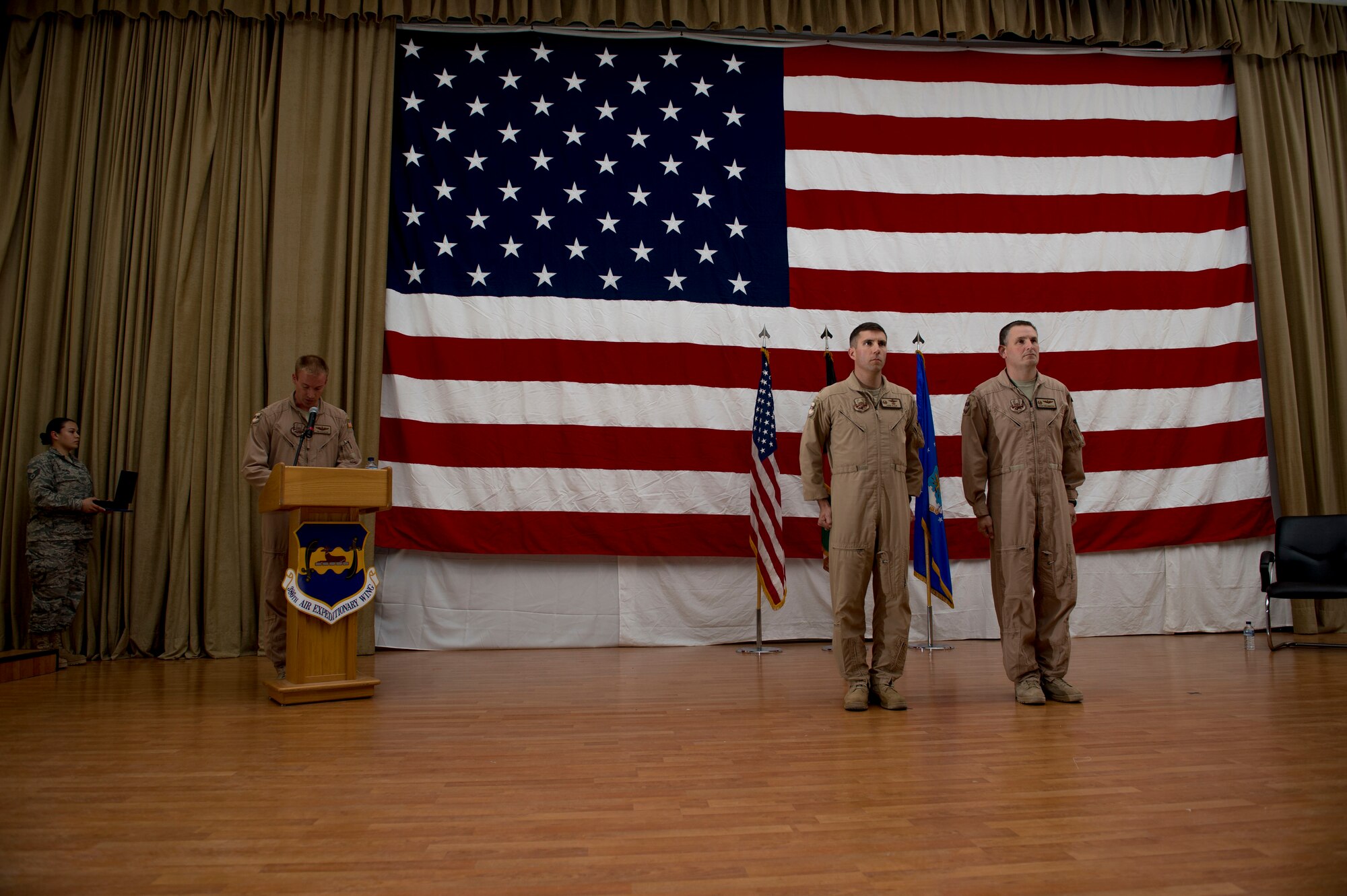 U.S. Air Force Col. John Klein presents Col. Douglas DeLaMater with the Bronze Star June 1, 2014 at an undisclosed location in Southwest Asia. DeLaMater was awarded the medal just before relinquishing command of the 386th Expeditionary Operations Group during a change of command ceremony. (U.S. Air Force photo by Staff Sgt. Jeremy Bowcock)