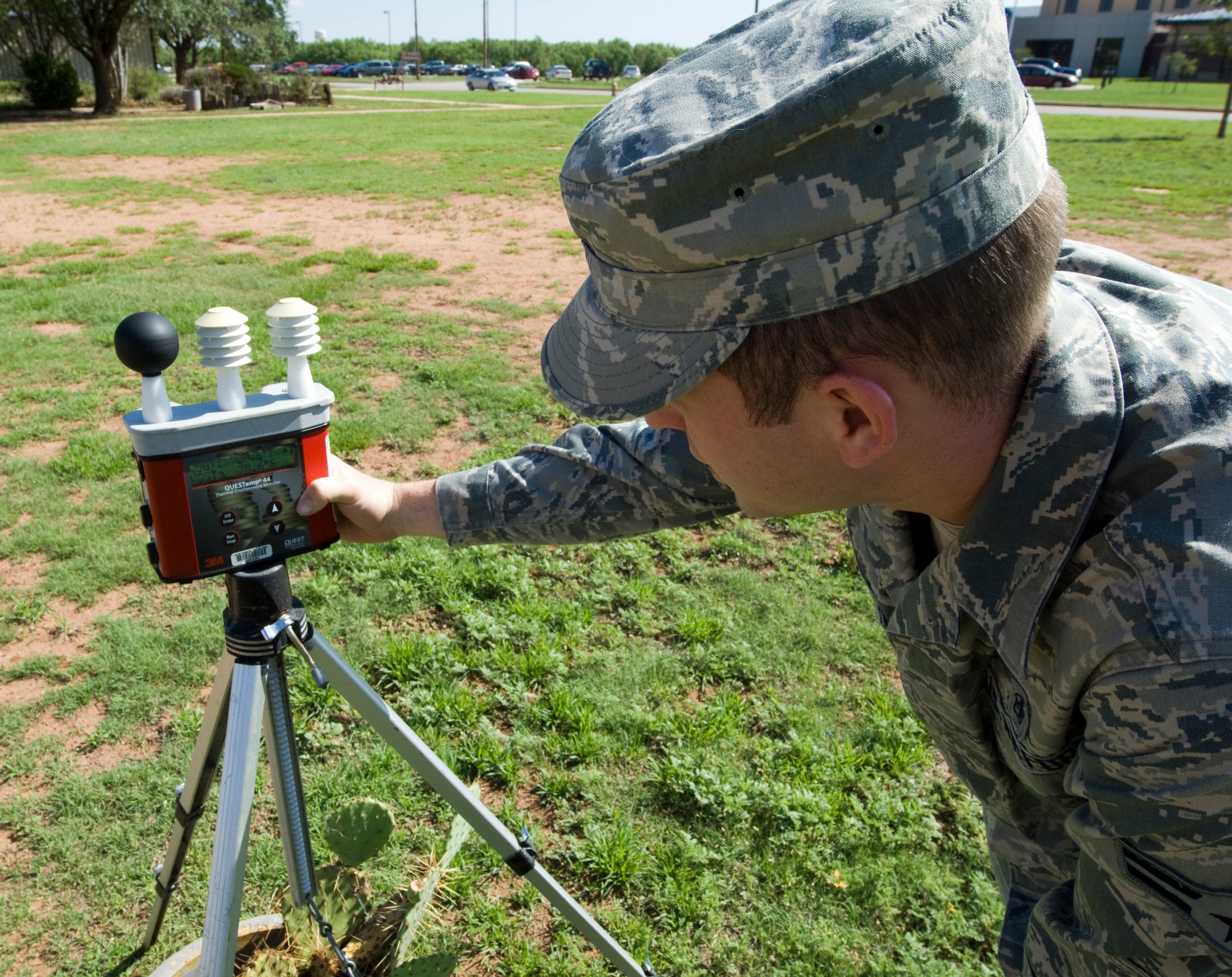 U.S. Air Force Airman 1st Class Adam Disque, 7th Aerospace Medicine Squadron bioenvironmental technician, checks the temperature May 29, 2014, at Dyess Air Force Base, Texas. Disque checks the temperature every hour to evaluate for heat-stress conditions. When the temperature rises above 82 degrees Fahrenheit heat-stress conditions start at stage two and can go as high as five when the temperature is above 90 degrees Fahrenheit. Once heat stress conditions are in effect Airmen must adhere to work/rest cycles. (U.S. Air Force photo by Airman 1st Class Kylsee Wisseman/Released)