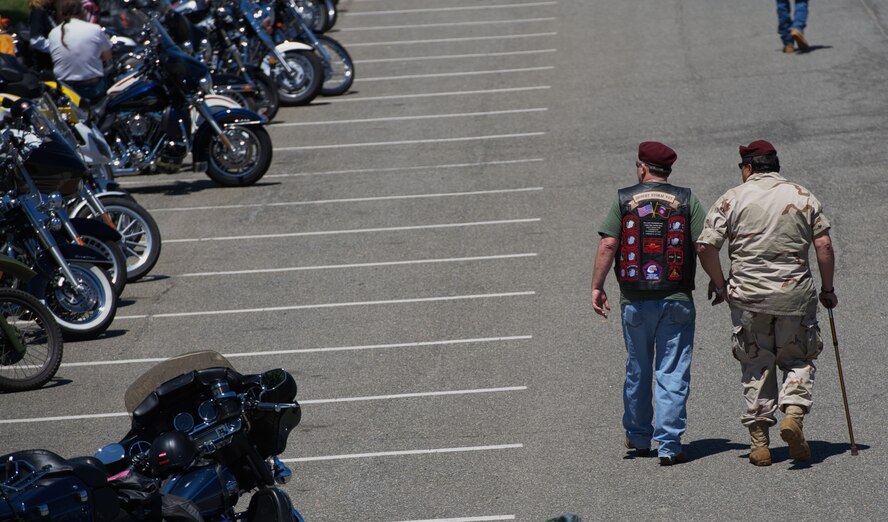 Desert Storm veterans stroll by parked motorcycles, staged for Rolling Thunder May 26, 2013 at the Pentagon in Washington, D.C. The annual Memorial Day motorcycle demonstration run attracts many war veterans and service members, who commemorate their lost and missing comrades on the occasion of memorial day. (U.S. Air Force photo/Senior Airman Alexander W. Riedel)