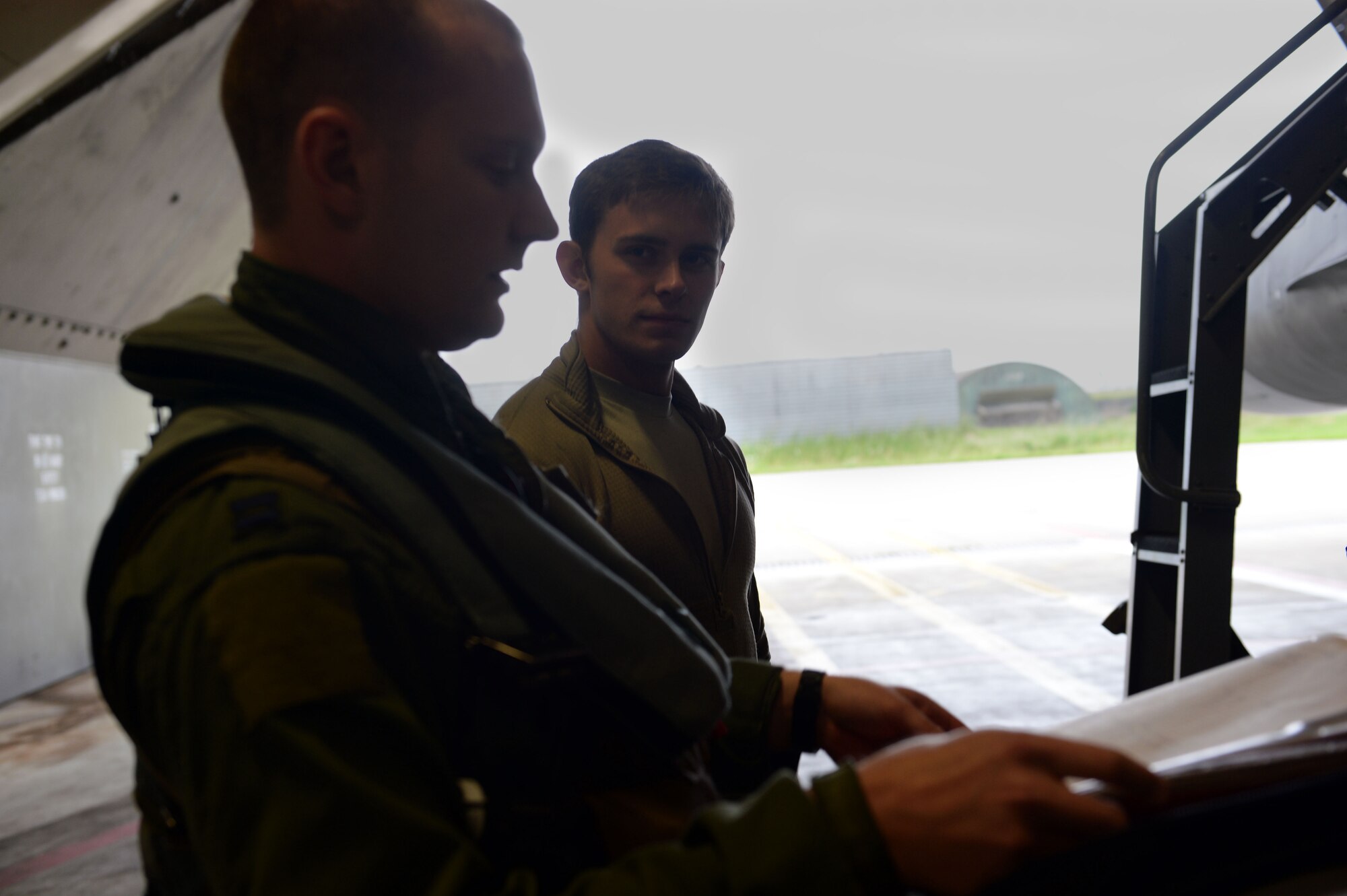 U.S. Air Force Capt. Eric Emerson, 480th Fighter Squadron pilot from Smyrna, Del., and U.S. Air Force Airman 1st Class Kyle Sumpter, 480th Aircraft Maintenance Unit crew chief from Fredrick, Md., go through pre-flight checks at Spangdahlem Air Base, Germany, before heading to the U.S. Air Force Aviation Detachment, Poland, May 30, 2014. Spangdahlem personnel traveled to Poland for their scheduled Av-Det rotation, but will also participate in a regional Joint Chiefs of Staff exercise called Baltic Operations 2014. (U.S. Air Force photo by Senior Airman Alexis Siekert/Released)  