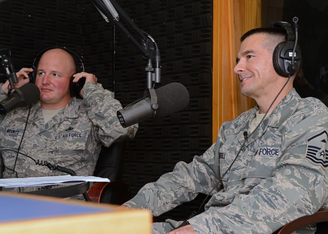AFN Aviano Radio interviews Master Sgt. Charles Cassell (right), first sergeant of the 175th Logistics Readiness Squadron and Master Sgt.  Steven Mounts, first sergeant of 31st Force Support Squadron, during the weekly “Shirt Dirt” segment, Friday May 30, 2014 at Aviano Air Base, Italy. Nearly 50 members of the Maryland Air National Guard deployed to Italy to train with their active duty counterparts. (National Guard photo by 2nd Lt. Benjamin Hughes/Released)
