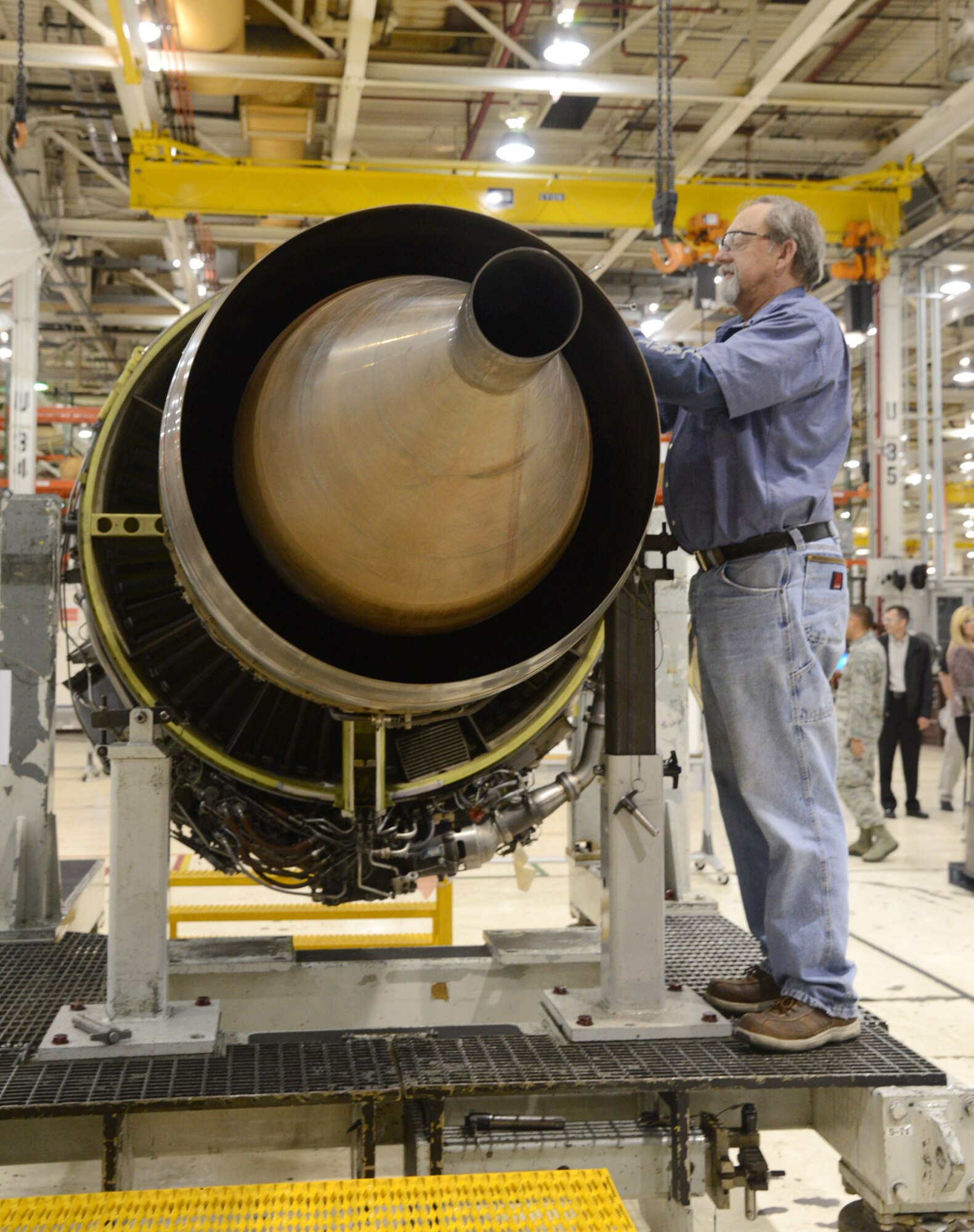 Engine Mechanic James Bunyard of the 548th Propulsion Maintenance Squadron works on an F108 engine at Bldg. 9001. The engine is one of the first 100 engines to receive the new C-PUP upgrade at Tinker. (Air Force photo by Kelly White)