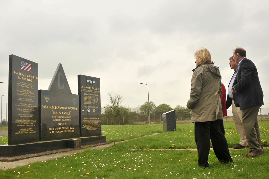 Second cousins of the late 2nd Lt. Jackson Palmer Jr., World War II 303rd Bombardment Group navigator, visit the 303rd BG Memorial at RAF Molesworth, United Kingdom April 28, 2014. After contacting the base historian, the family coordinated an 18-day trip to England and The Netherlands to gather information about how Palmer lived, how he died and where he was buried. (U.S. Air Force photo by Staff Sgt. Ashley Hawkins/Released)