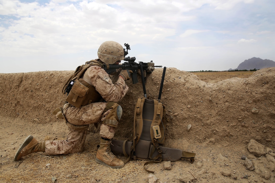 U.S. Marine Corps Lance Cpl. Heroshi Mendoza provides security from ...