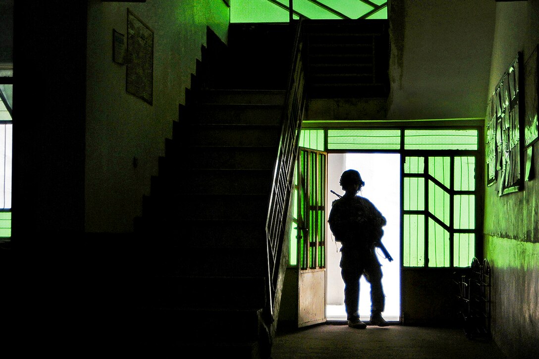 U.S. Army Sgt. 1st Class Michael Nelson provides security during a mission to Farah Midwife School in Farah City in Afghanistan's Farah province, May 26, 2012. Nelson is assigned to Provincial Reconstruction Team Farah, which includes Alaska's National Guard infantrymen, who are responsible for ensuring the safety of the entire team. 
