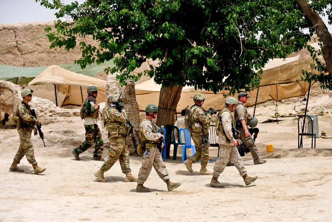 Members of Provincial Reconstruction Team Farah, which include U.S. troops, leave the Afghan police compound following a graduation ceremony for new officers in Bala Baluk in Afghanistan's Farah province, May 29, 2012. 
