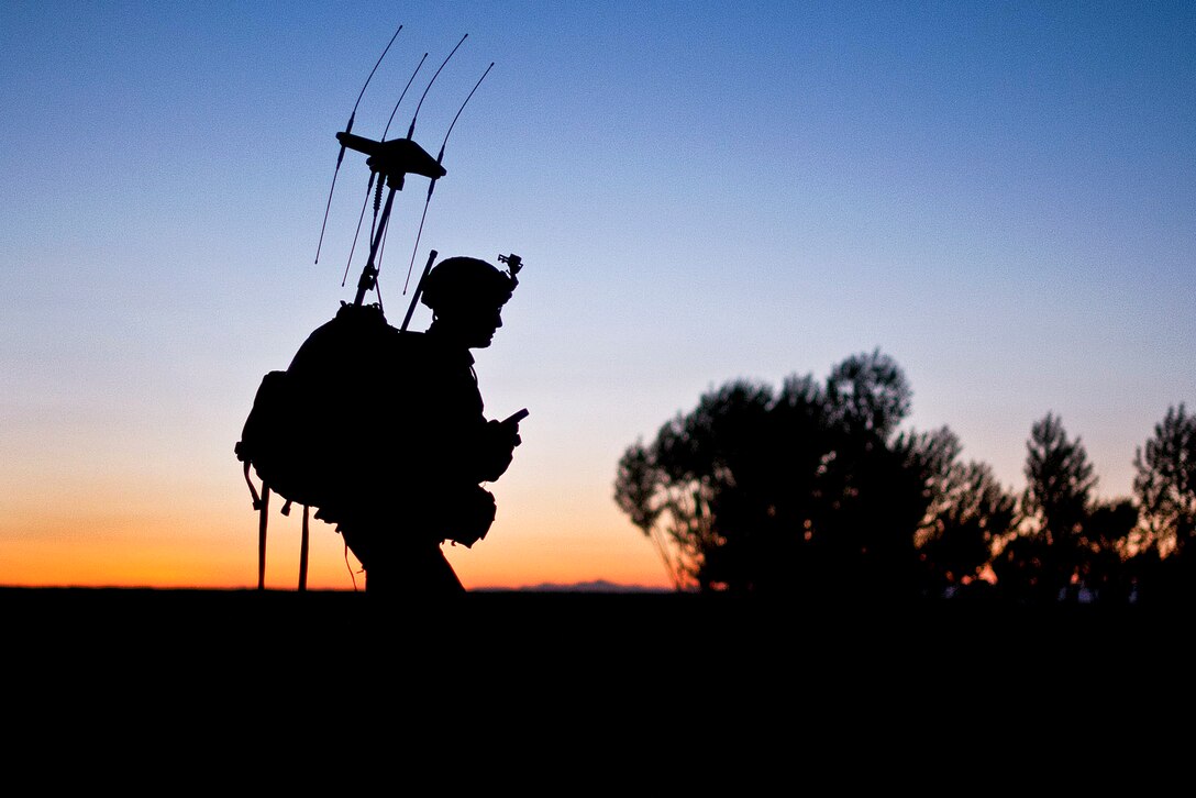 A U.S. paratrooper patrols as the sun rises in a village in Ghazni province, Afghanistan, May 4, 2012. The soldier is assigned to the 82nd Airborne Division’s 1st Brigade Combat Team.  
