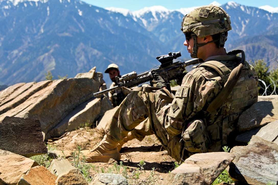 U.S. Army Pfc. Jeffery Penning and an Afghan security guard pull security during a roving patrol on Observation Post Mustang in Afghanistan's Kunar province, May 3, 2012. Penning is assigned to the 4th Infantry Division's Company C, 1st Battalion, 12th Infantry Regiment. 
