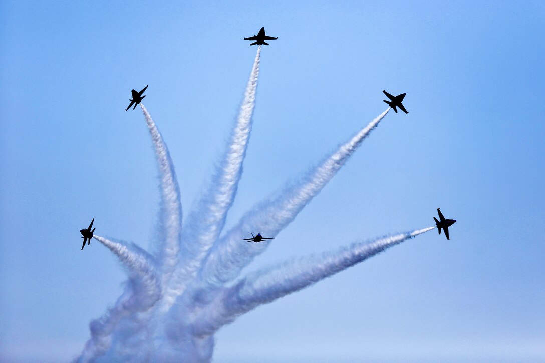 The Blue Angels, the Navy's flight demonstration squadron, shoot off in different directions during the 2012 Robins Air Show over Robins Air Force Base, Ga., April 29, 2012.  
