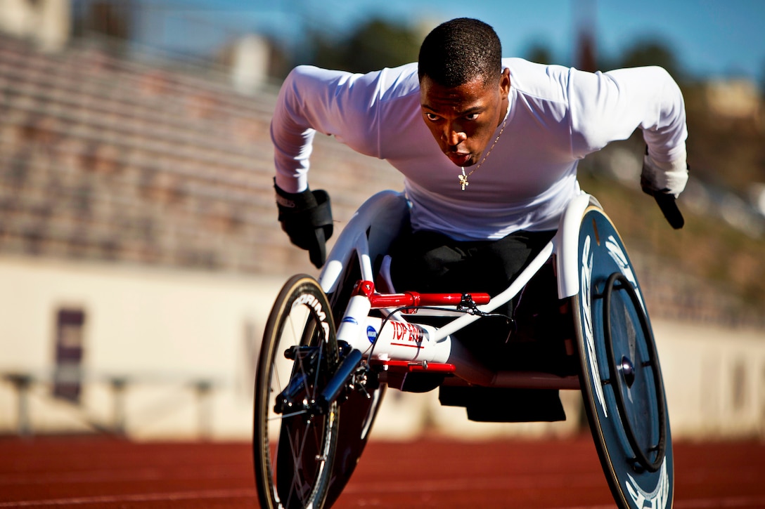 U.S. Marine Corps Cpl. Anthony McDaniel races around the track during practice for the 2012 Warrior Games in Colorado Springs, Colo., April 23, 2012. McDaniel suffered a bilateral leg and partial hand amputations from an improvised explosive device in Afghanistan 2010. He is competing in track and wheelchair basketball.  
