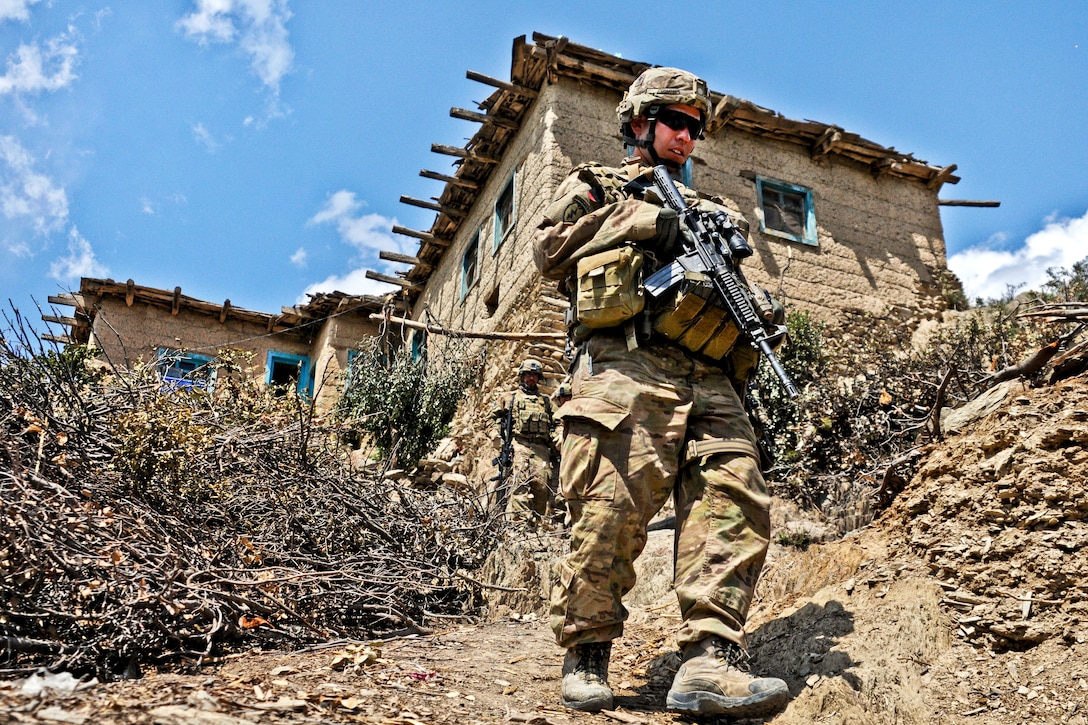 U.S. Army 1st Lt. Ryan Gibbons steps down a hillside while on patrol during Operation Marble Lion in Afghanistan's Jani Khel district, April 12, 2012. Gibbons, a platoon leader, is assigned to Company C, 3rd Battalion, 509th Infantry Regiment.  
