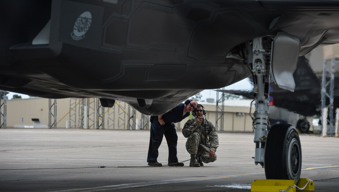 Airmen from the 58th Aircraft Maintenance Unit look over the 26th and final F-35A Lightning II May 28, 2014, assigned to the 33rd Fighter Wing on Eglin Air Force Base, Fla. The arrival of the final F-35A marks a shift in priorities for the 58th Fighter Squadron and 58th AMU, since the first F-35A was delivered in July 2011. (U.S. Air Force photo/Senior Airman Christopher Callaway)